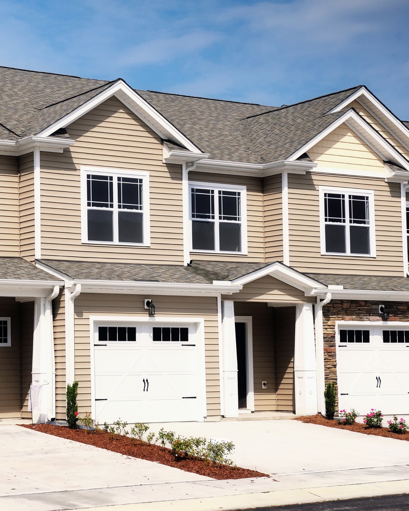 Townhome-style residential property with two-car garages