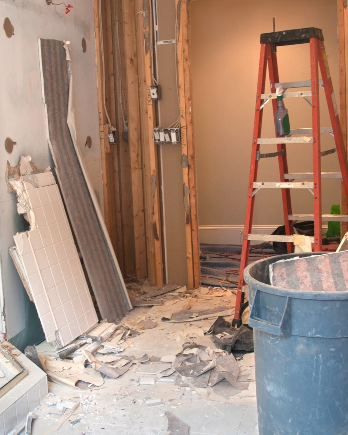 Mid-renovation interior with ladder and exposed framing